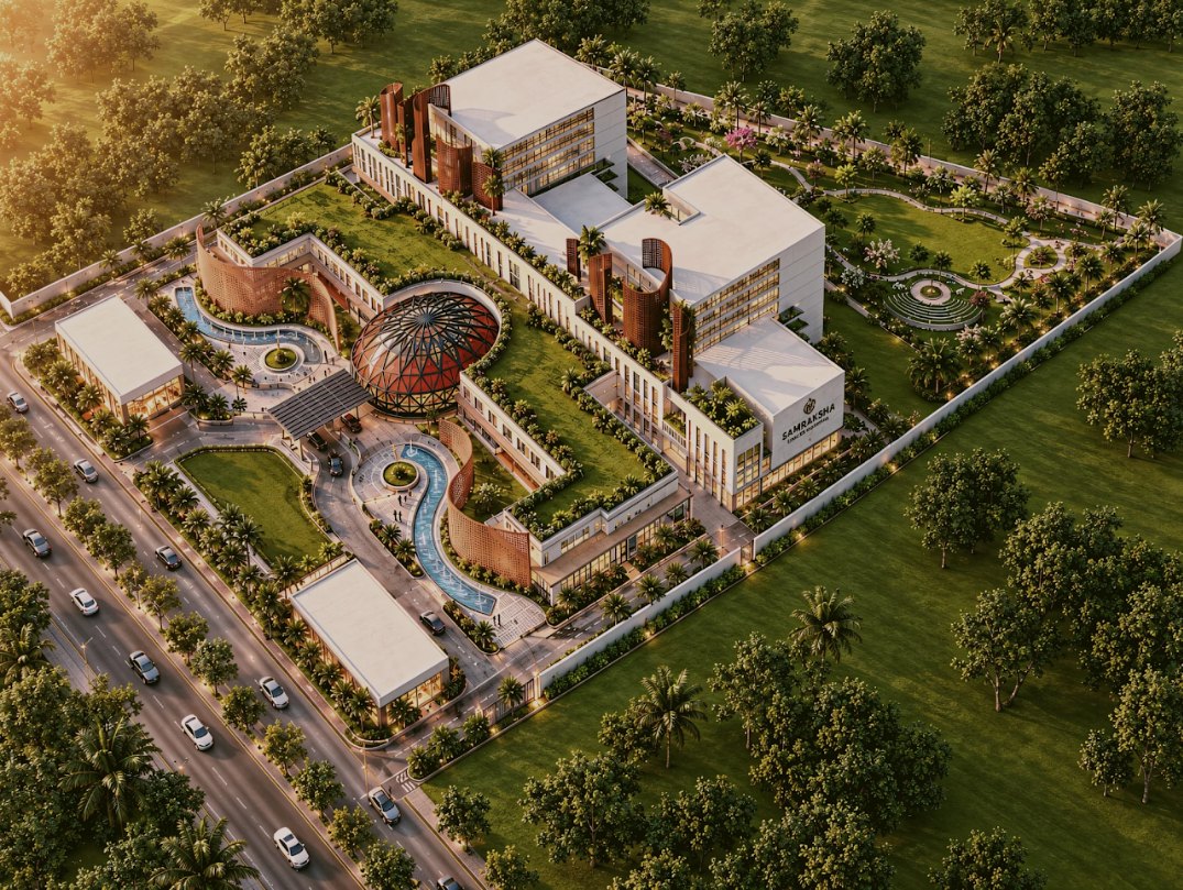 Aerial visualization of the cancer hospital campus with its central dome and healing gardens